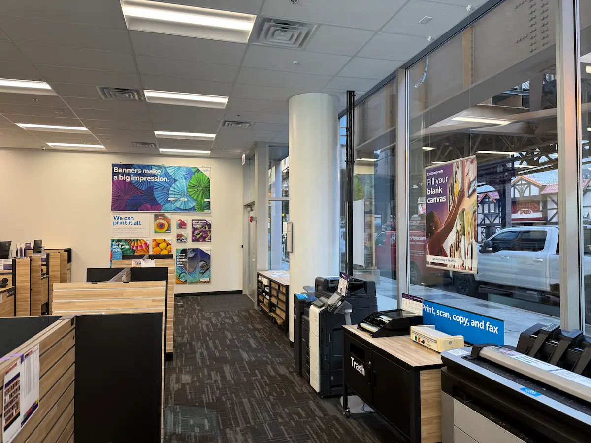 Interior of FedEx Office in Chicago, showcasing print service displays, office equipment, and energy-efficient lighting, reflecting Flavin Electric's electrical installation work for commercial spaces.